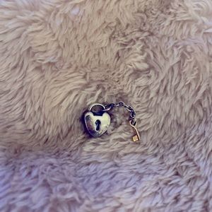 Pandora heart and key charm.